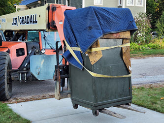Forklift placing the safe